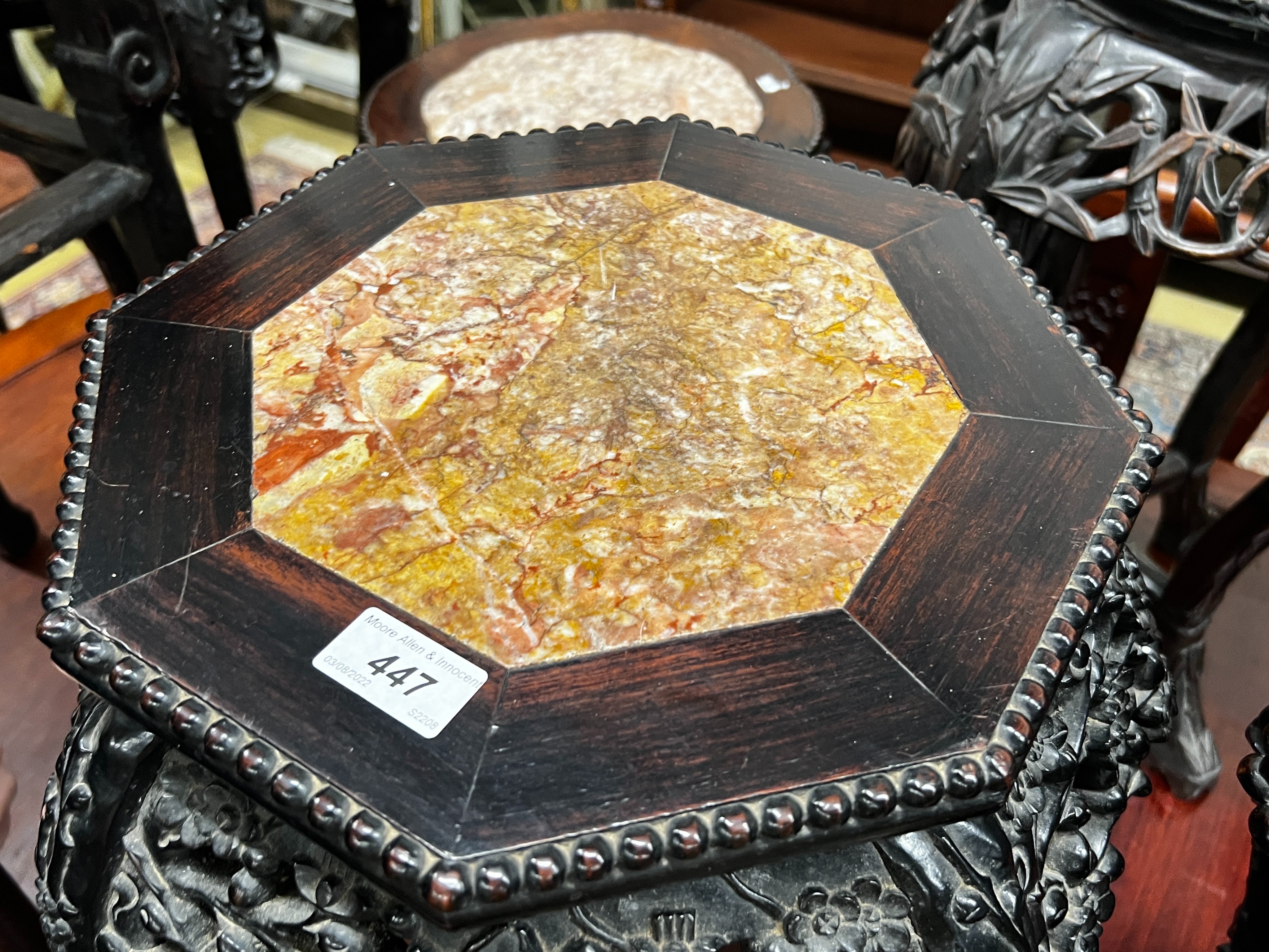 A near pair of Chinese marble top octagonal carved hongmu vase stands, width 40cm, height 62cm